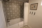 Guest bedroom with tub shower combination
